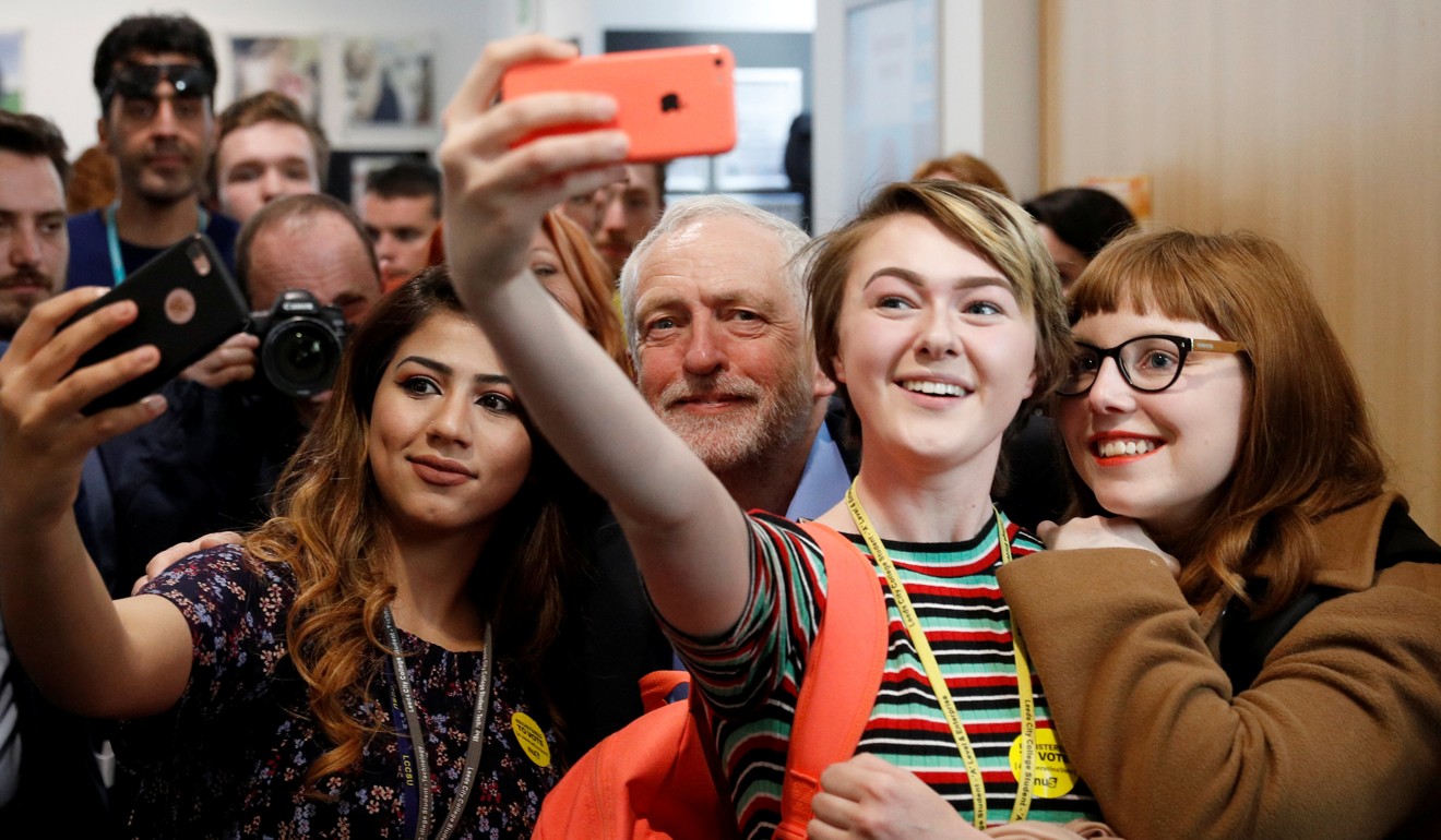 Jeremy Corbyn, leader of Britain’s opposition Labour Party, poses for selfies at a campaign event in Leeds, on May 10. British experts underestimated Corbyn’s appeal to the under-35s in the June 8 election. Photo: Reuters