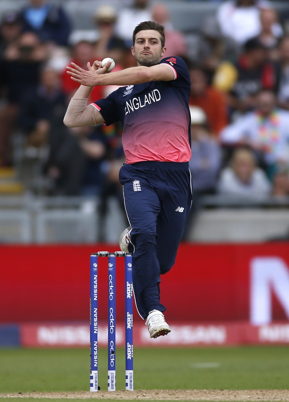 England's Mark Wood bowls on his way to career-best figures of four for 33 against Australia in the Champions Trophy.