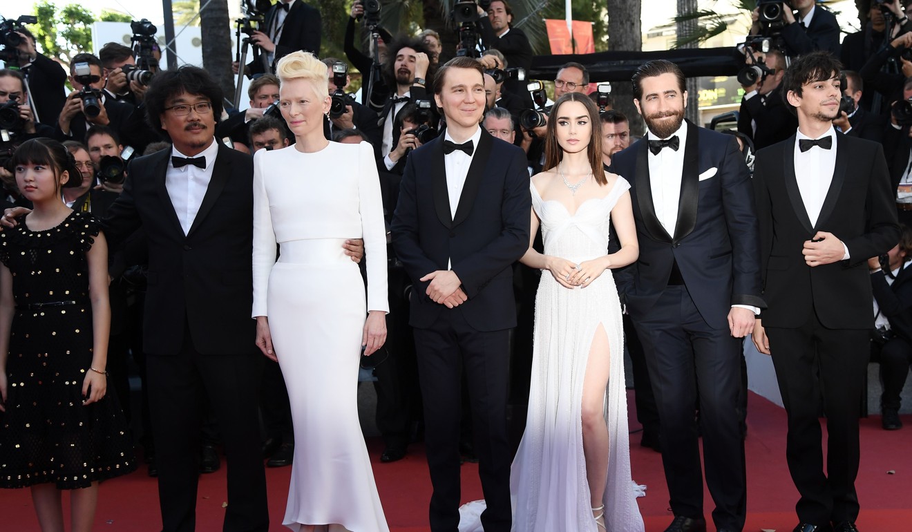 From left: Ahn Seo-hyun, Bong Joon-ho, Tilda Swinton, Paul Dano, Lily Collins, Jake Gyllenhaal and Devon Bostick at the Cannes Film Festival premiere of Okja. Photo: AFP