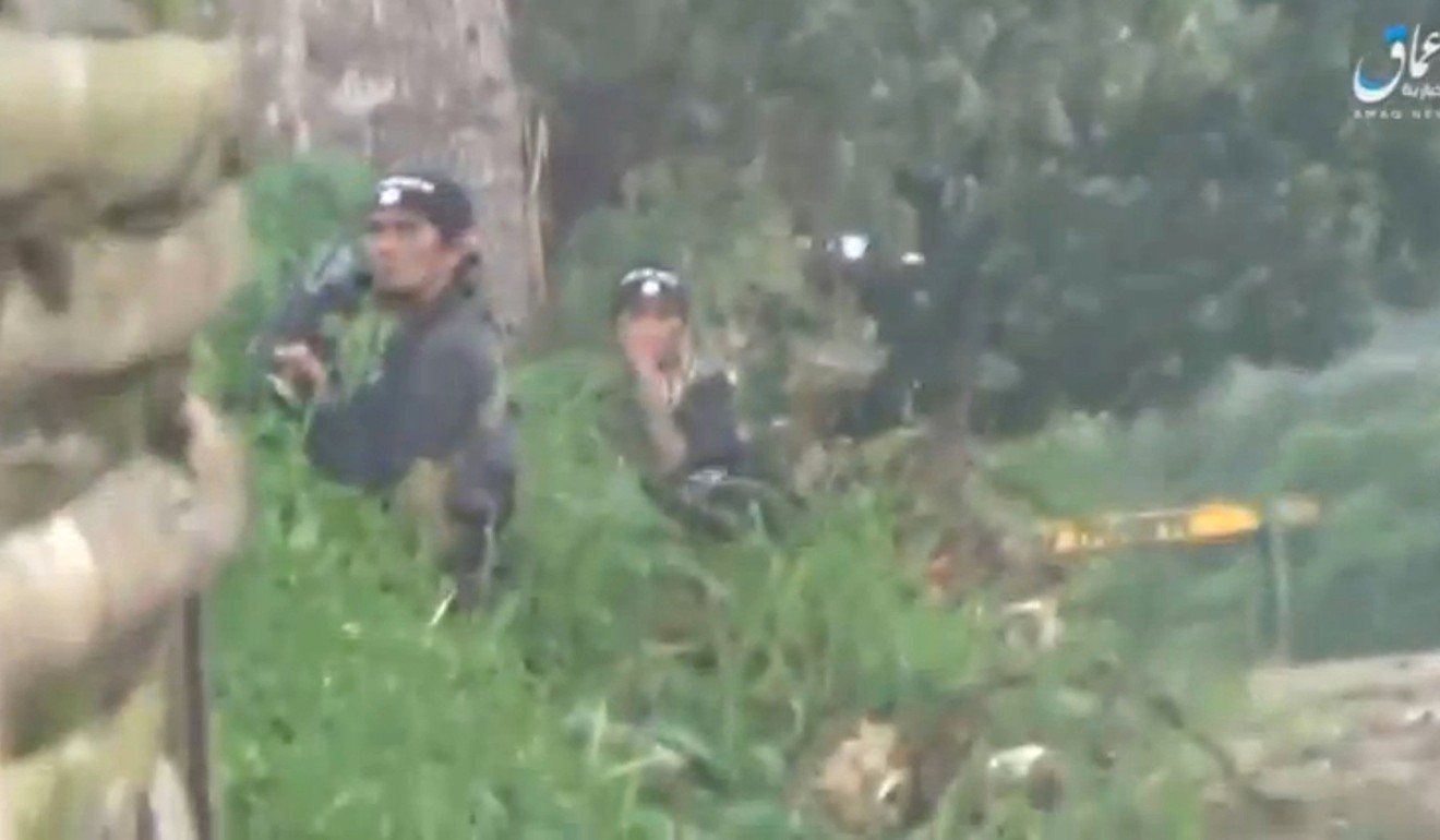 Militants in Marawi City, Philippines, wearing Islamic State head bands. Photo: Reuters