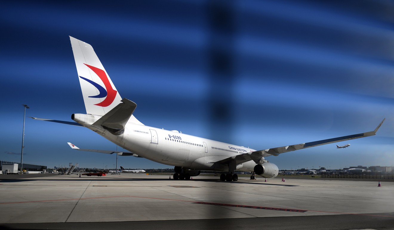 The China Eastern Airlines aircraft seen on the tarmac at Sydney Airport after it was forced to turn back shortly after take off when a massive hole was found in its left engine. Photo: EPA