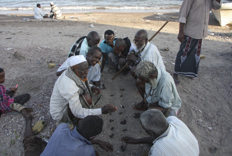 Men play a traditional Afar game at a beach in Tadjoura. Picture: James Jeffrey