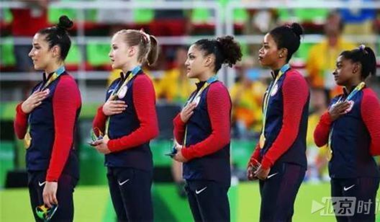 US athletes listening to the national anthem – hand on heart. Photo: Handout
