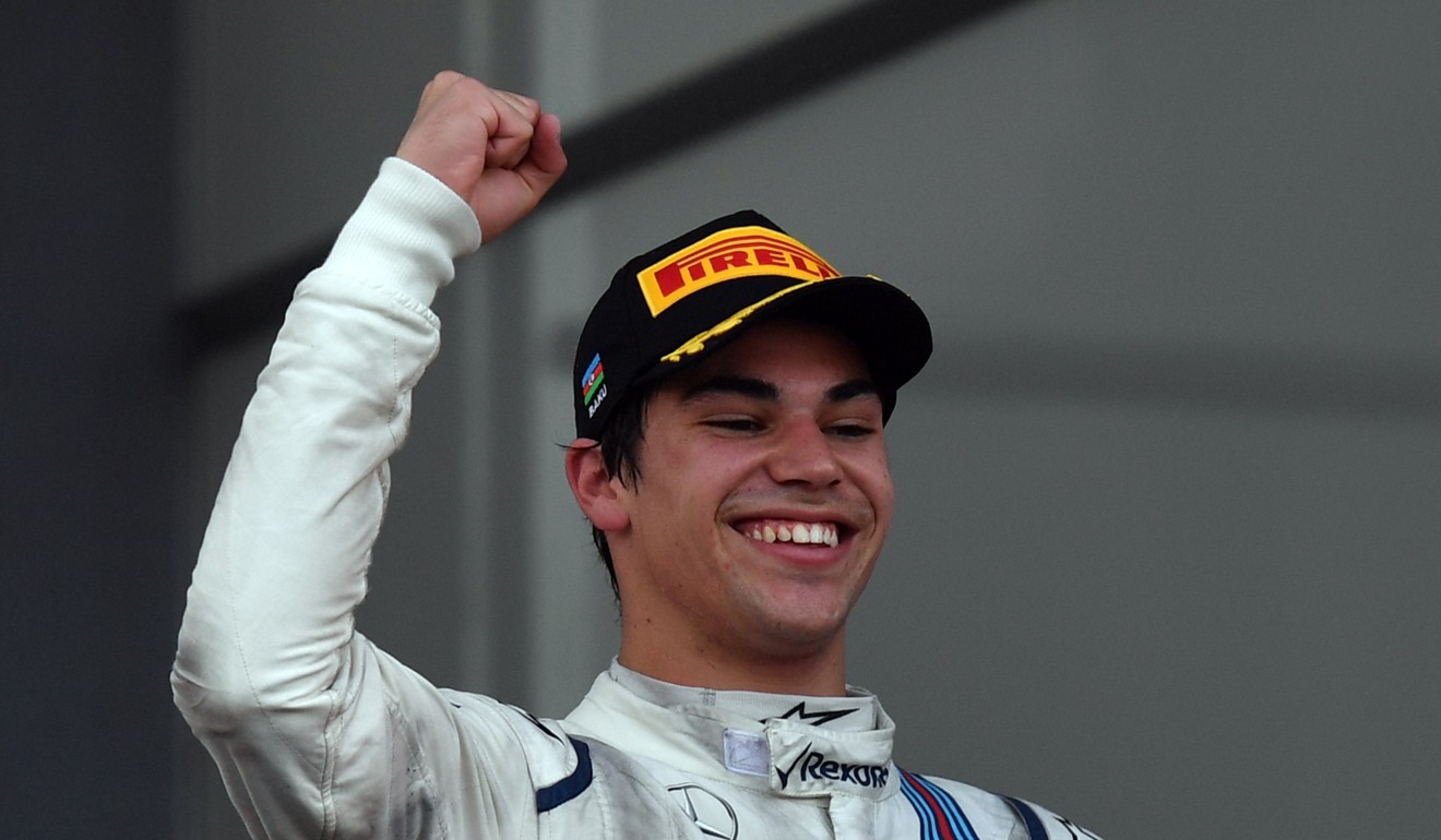 Third placed Williams' Canadian driver Lance Stroll celebrates after becoming the youngest-ever F1 podium finisher. Photo: AFP