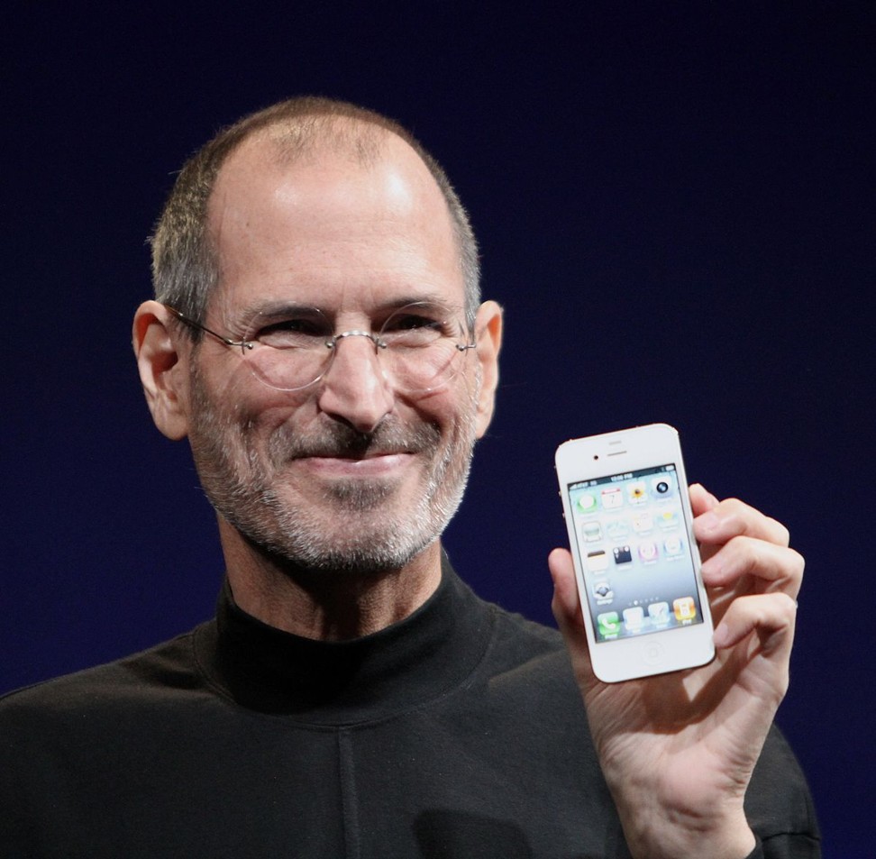 Former Apple CEO Steve Jobs with an iPhone 4 in 2010.