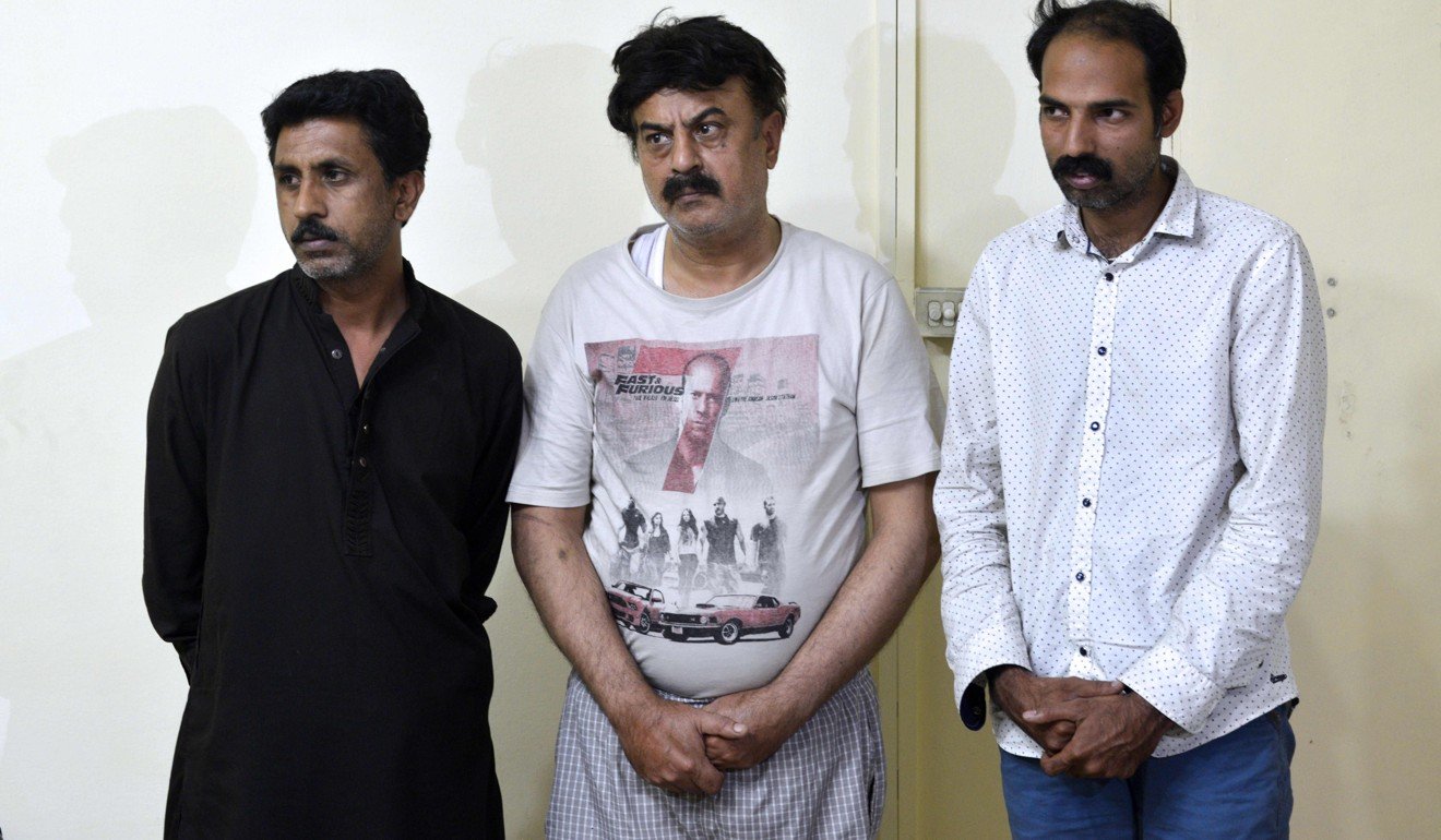 Arrested doctor Fawad Mumtaz (centre) and his assistants, who were conducting unauthorised surgeries for international clients. Photo: AFP