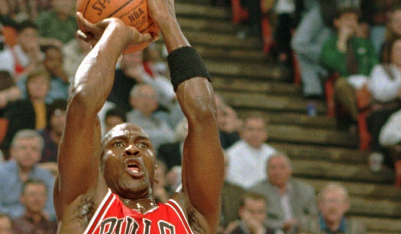 Chicago Bulls' Michael Jordan (23) jumps to shoot a three pointer in 1996. Photo: AP