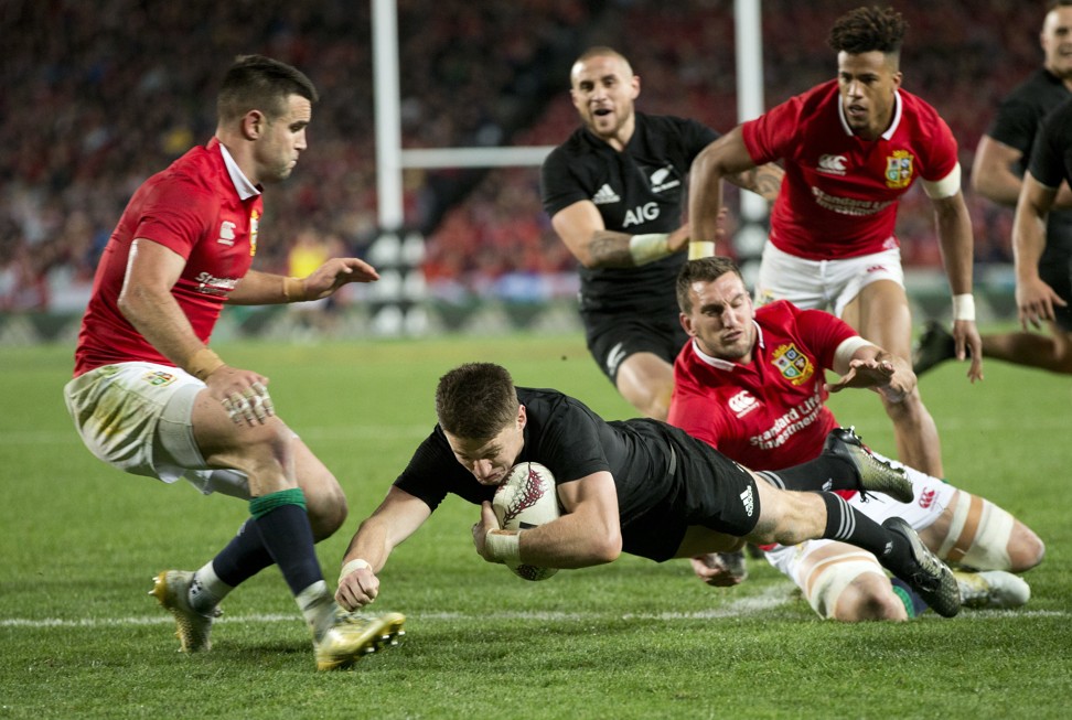 All Blacks Beauden Barrett is tackled by Warburton and Conor Murray during the first test. Photo: AP