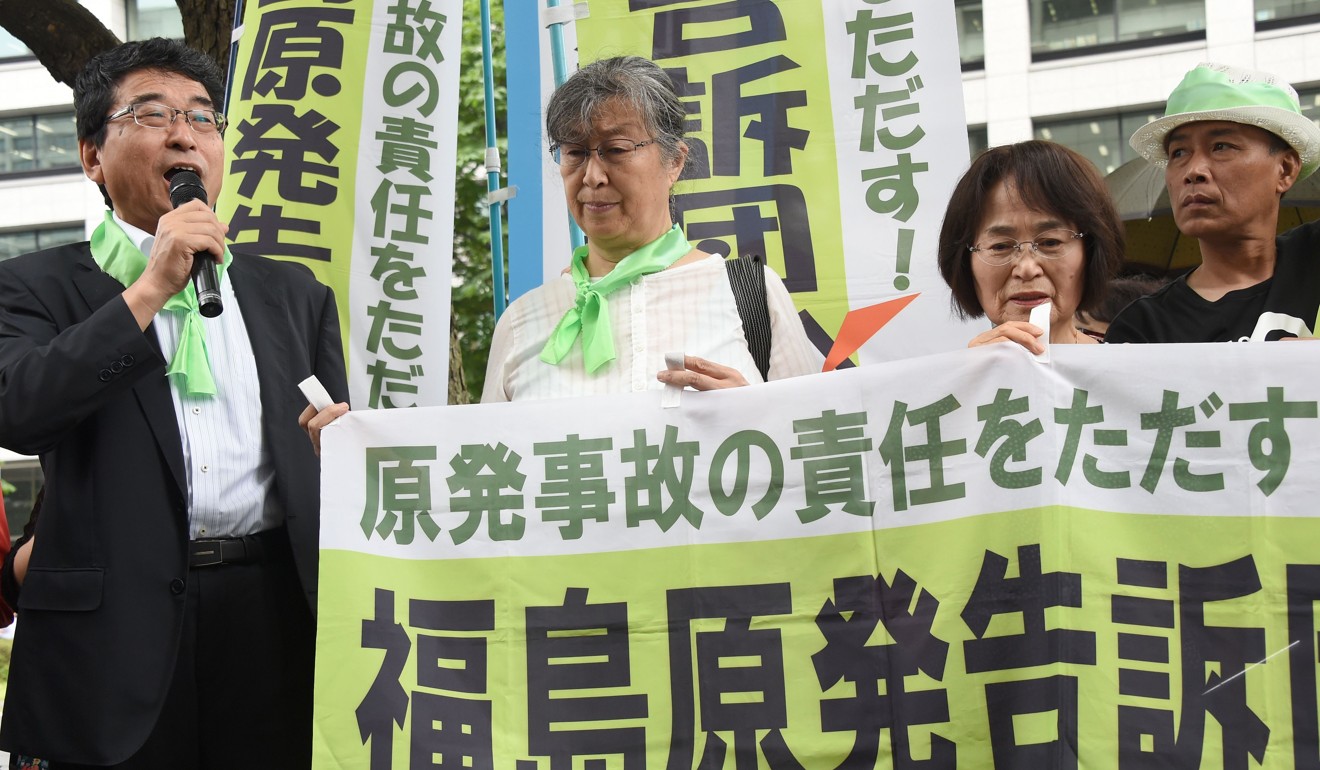 Protesters outside the court in Tokyo. Photo: AFP