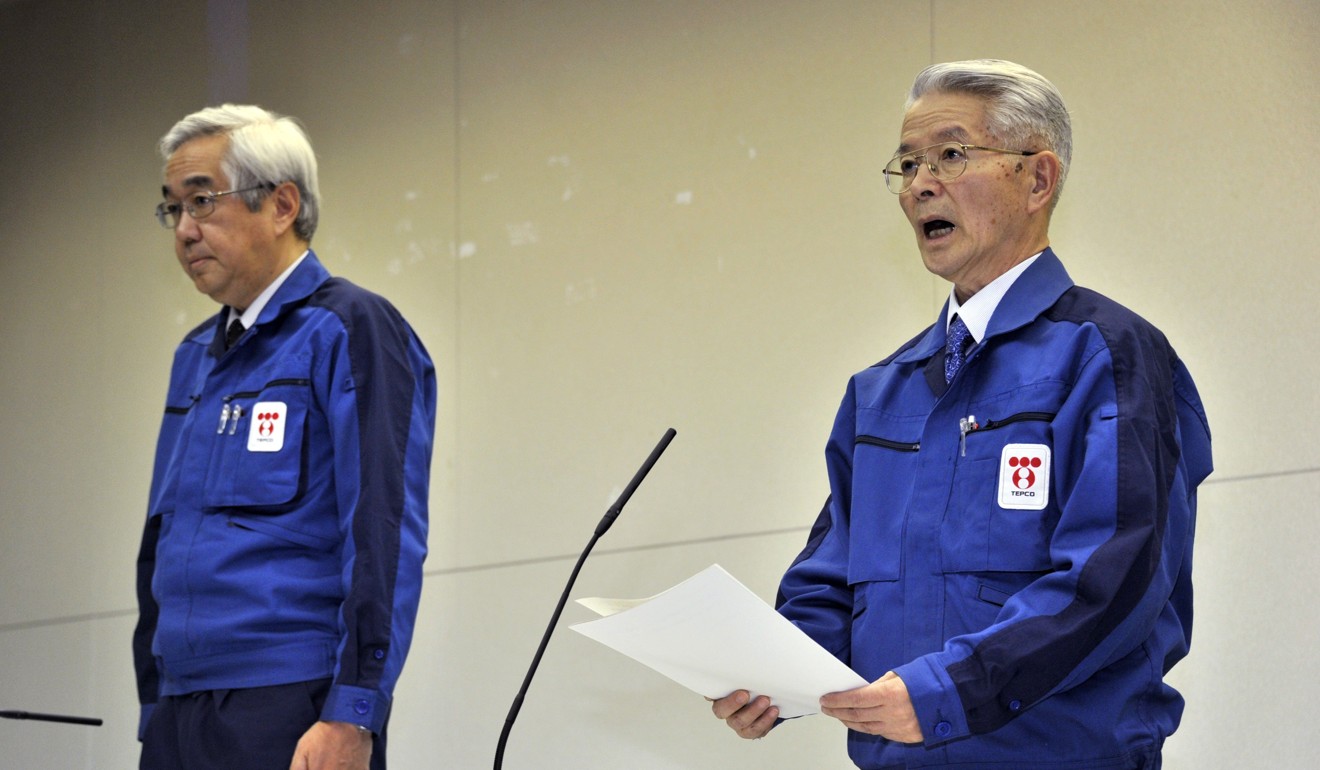 An April, 2011 photo of former Tepco chairman Tsunehisa Katsumata (right) and former vice-president Sakae Muto at a press conference in Tokyo. Photo: AFP