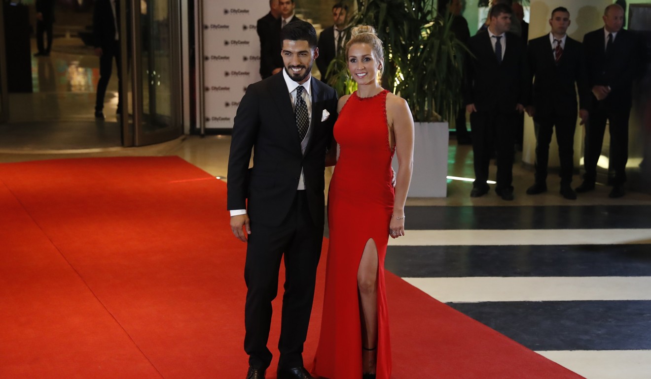 Luis Suarez and his wife Sofia Balbi. Photo: EPA