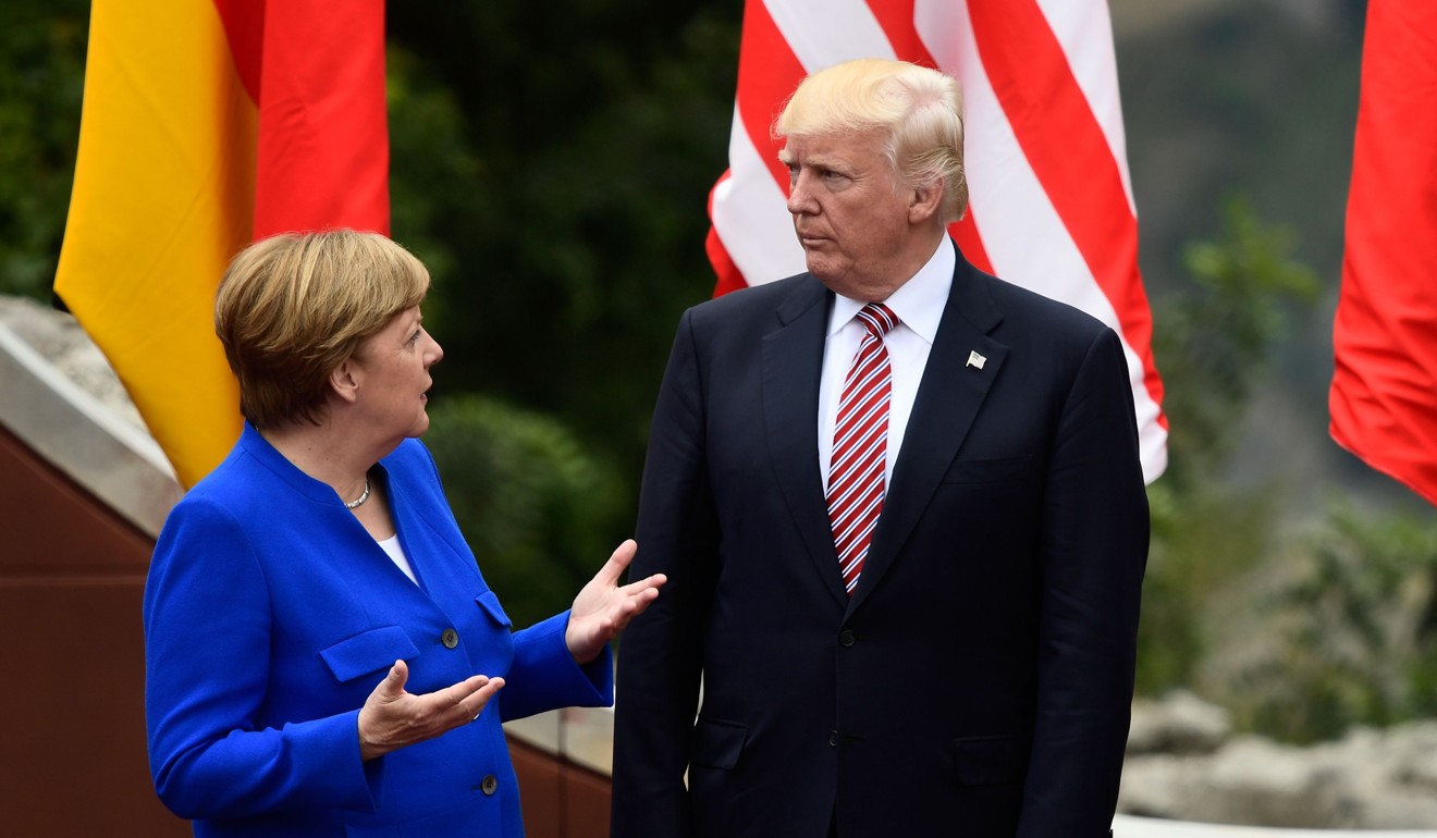 A photo taken on May 26 shows German Chancellor Angela Merkel talking with US President Donald Trump at the Summit of the Heads of State and of Government of the G7 in Taormina, Sicily. Photo: AFP