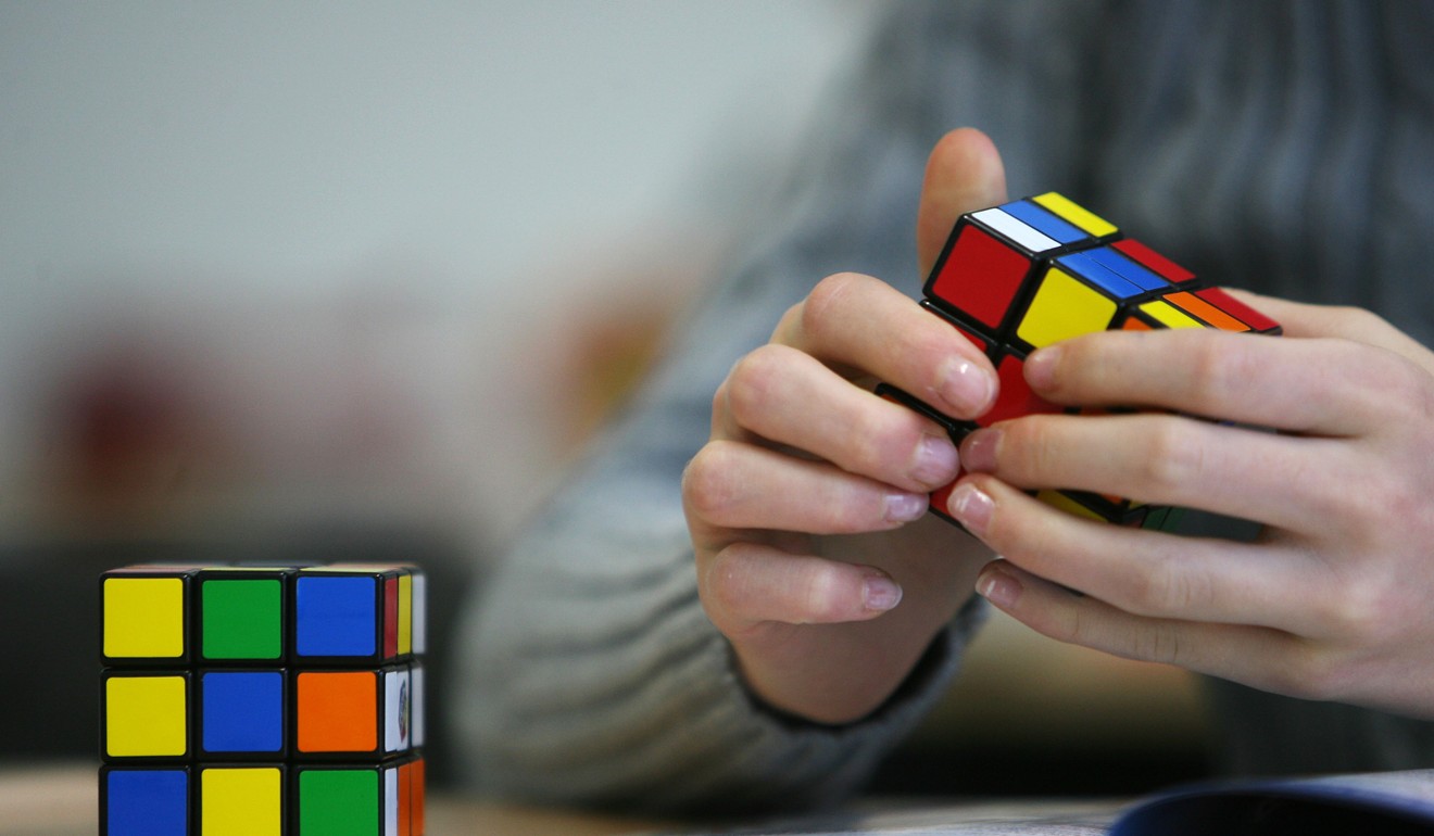 Seventh-graders at a Duesseldorf school use a Rubik's Cube to develop spatial thinking and imagination. Photo: AFP