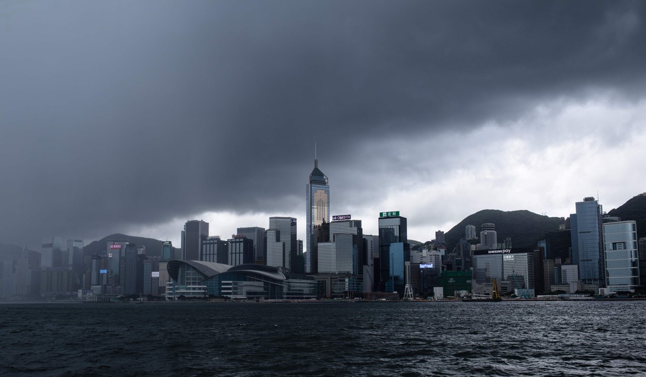 Rain clouds from a tropical storm gather over Hong Kong. Mental health problems are the product of our circumstances; and encountering such life circumstances is part of being human. Photo: AFP
