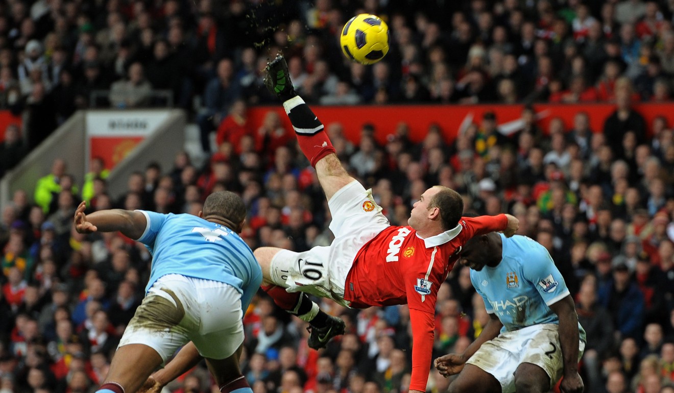 Wayne Rooney scores one of his most famous goals in a United shirt, an overhead kick in a 2011 Manchester derby against City at Old Trafford. Photo: AFP