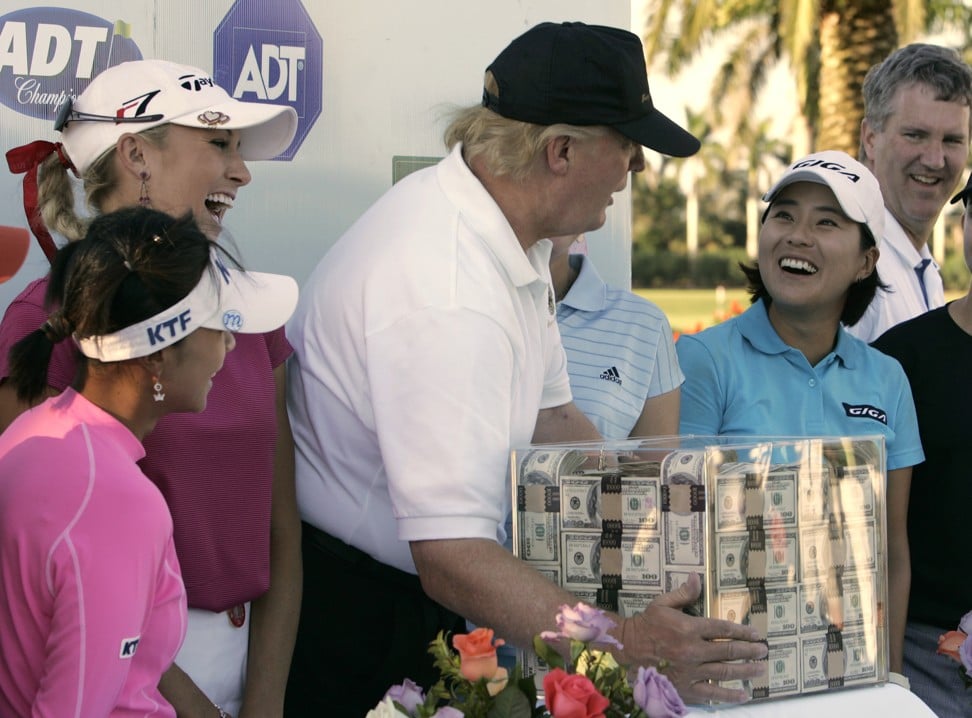 Donald Trump, in 2006, with the golfers who qualified for the final round of the LPGA ADT Championship at the Trump International Golf Club in West Palm Beach. Photo: AP
