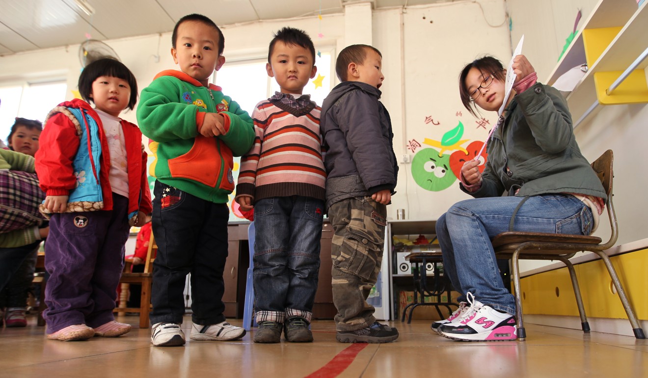 Children line up to learn Chinese characters at the Jinbang Kindergarten in Beijing. Photo: Simon Song
