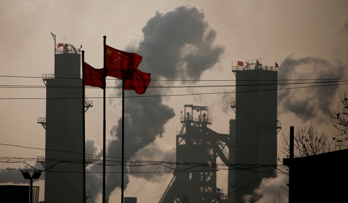 Chinese national flags fly near a steel factory in Wu'an, Hebei province. Photo: Reuters
