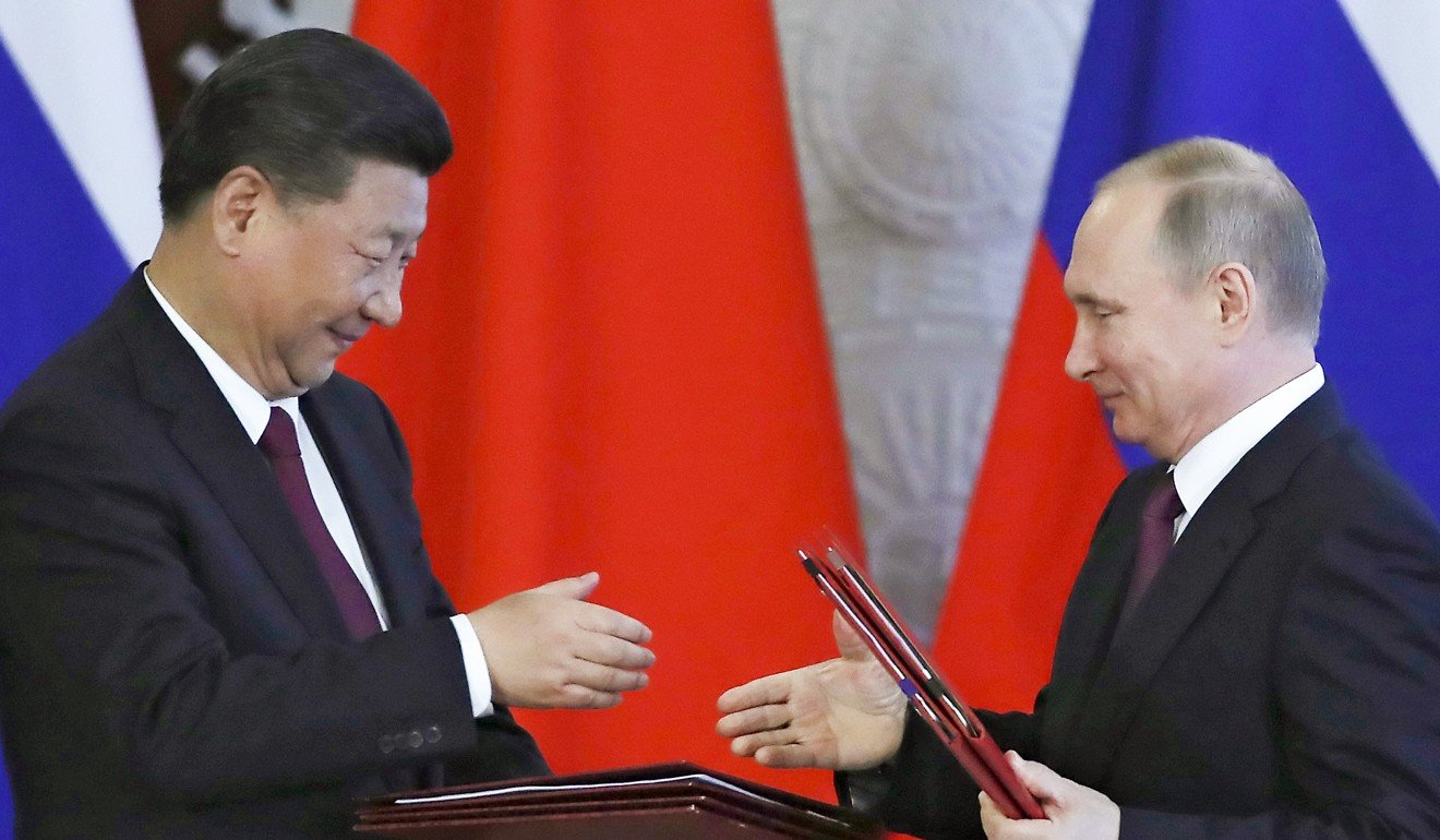 Presidents Xi Jinping and Vladimir Putin sign off on agreements following talks at the Kremlin on July 4. Photo: AP