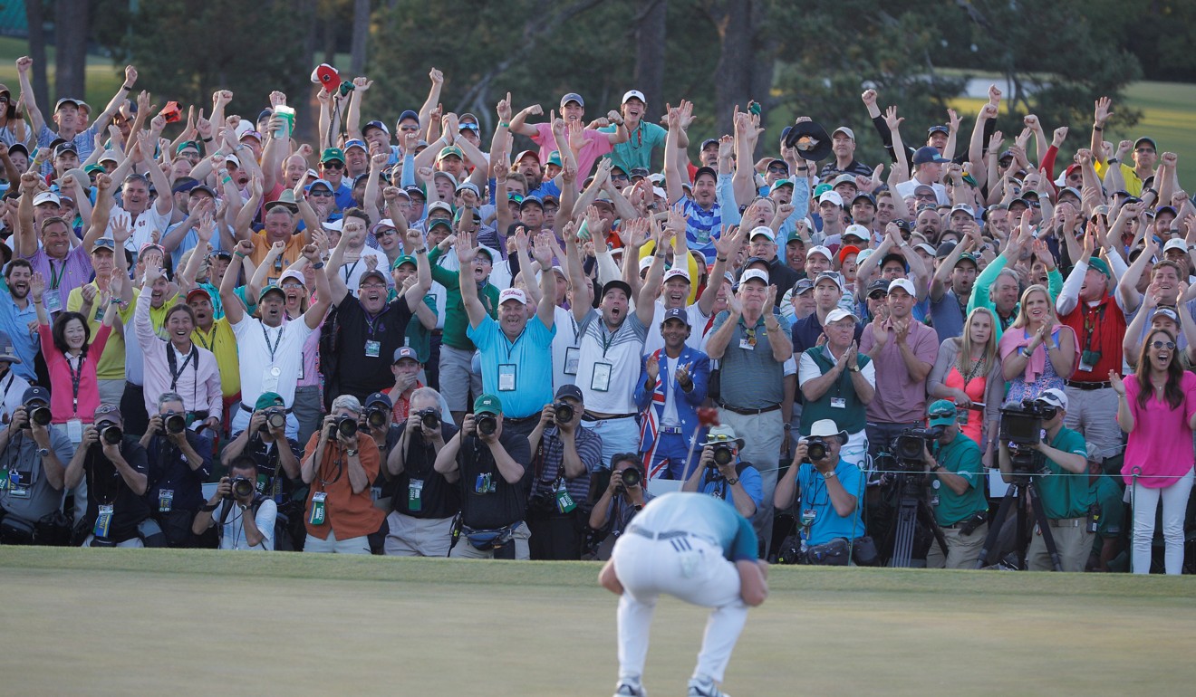 The gallery on the 18th green of the Masters erupt as Sergio Garcia of Spain celebrates winning the Masters with a putt during a play-off against Justin Rose of England in the final round of the 2017 Masters golf tournament at Augusta National Golf Club in Augusta, Georgia. Photo: Reuters
