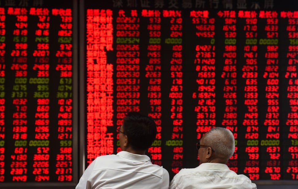 (FILES) This file photo taken on June 15, 2016 shows investors monitoring stock price movements at a securities company in Beijing on June 15, 2016. Chinese shares will be included for the first time in a leading US-based index of emerging market shares, New York-based MSCI announced on June 20, 2017.Photo: AP