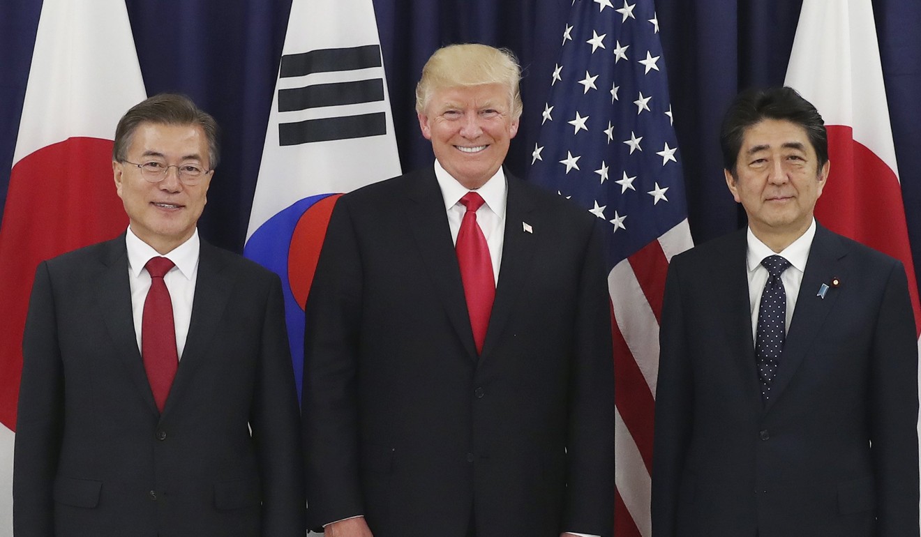 South Korean President Moon Jae-in (left), US President Donald Trump and Japanese Prime Minister Shinzo Abe before their meeting at the US consulate in Hamburg, on July 6. The leaders, in the city for the July 7-8 G20 summit, agreed to get tougher on North Korea’s nuclear and missile programmes. Photo: EPA