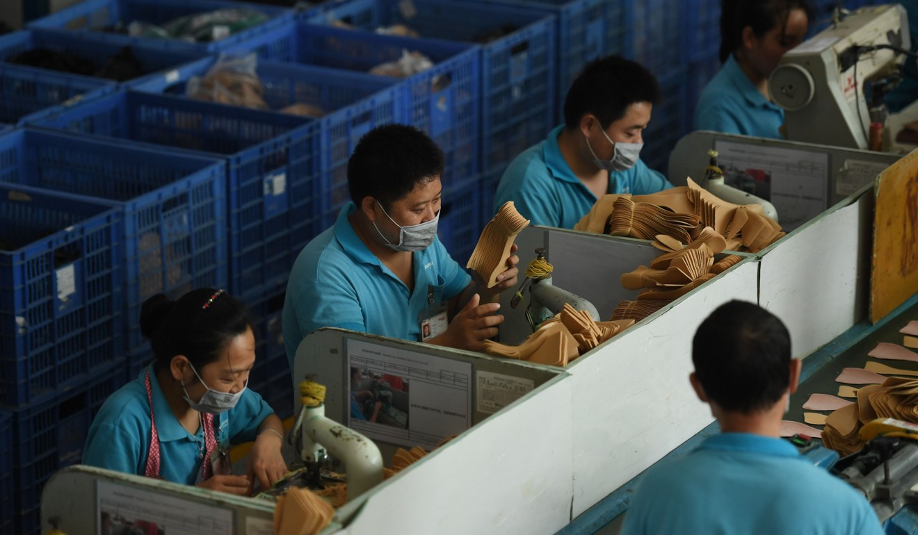 Workers at a shoe factory in Dongguan, Guangdong province. Picture: AFP