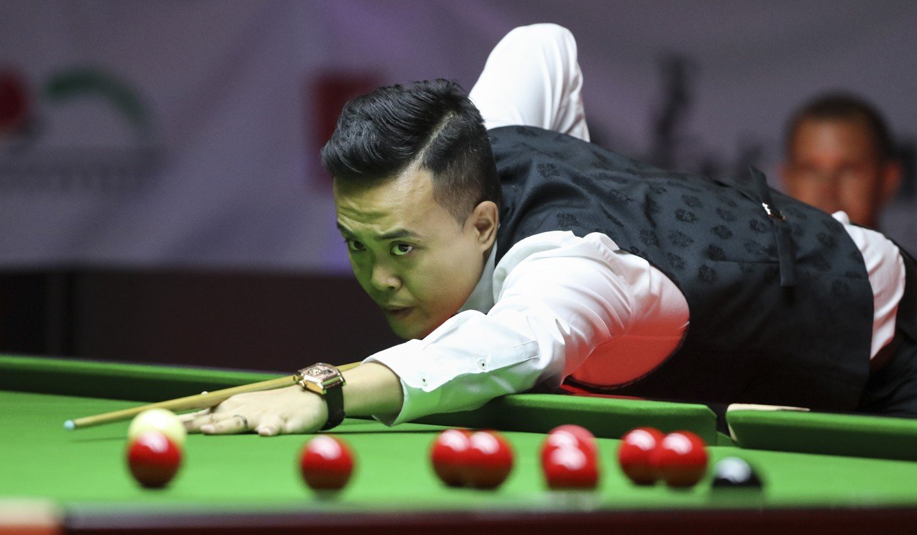 Marco Fu during his match against England’s Barry Hawkins.