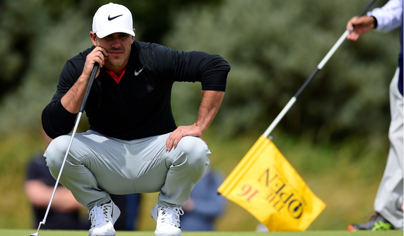 Brooks Koepka lines up a putt during the first round. Photo: Reuters