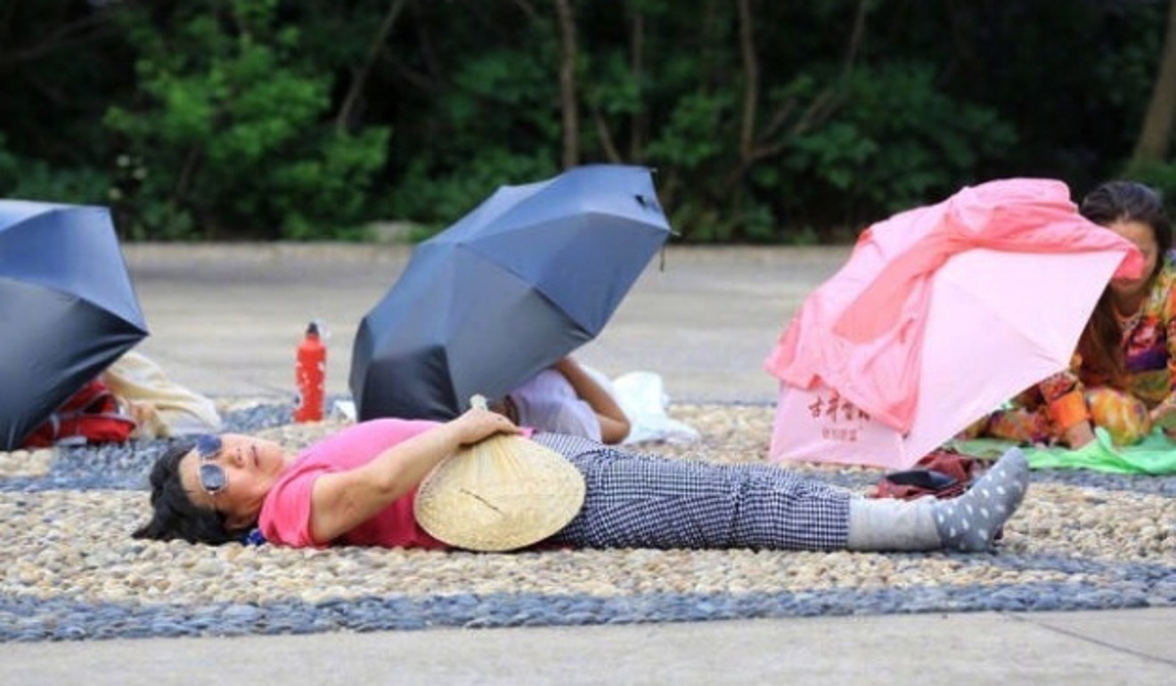 Women treat themselves to a free hot stone massage at a public plaza in Huaibei, Anhui province. Photo: Handout