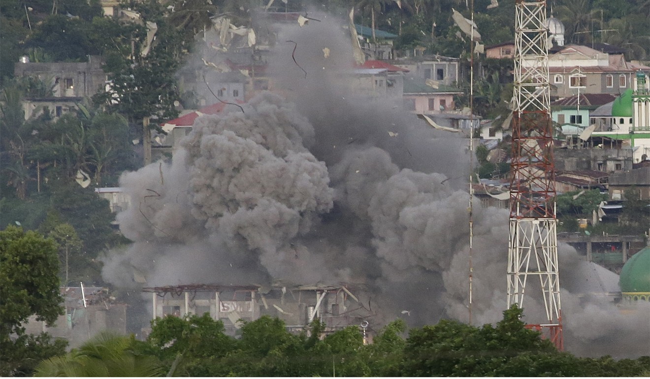 A cloud of debris in Marawi after Philippine Air Force fighter jets bomb suspected positions of Muslim militants. Photo: AP