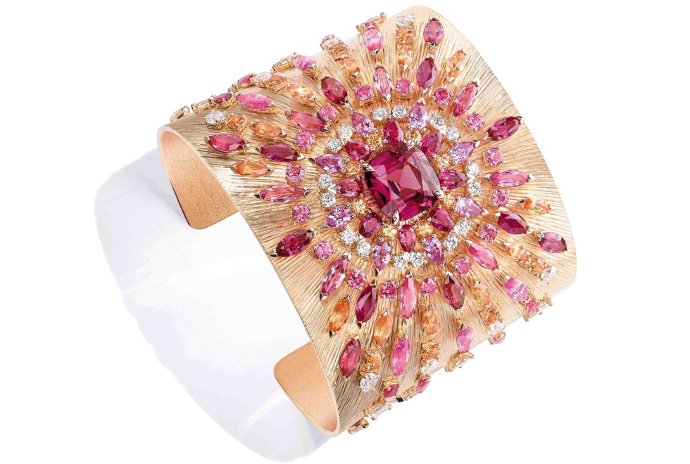 Inspired by rays of sunlight, the cuff is embellished with one cushion-cut, purplish-pink spinel, red spinels, pink spinels, pink sapphires, spessartite garnets and diamonds, HK$3.04 million