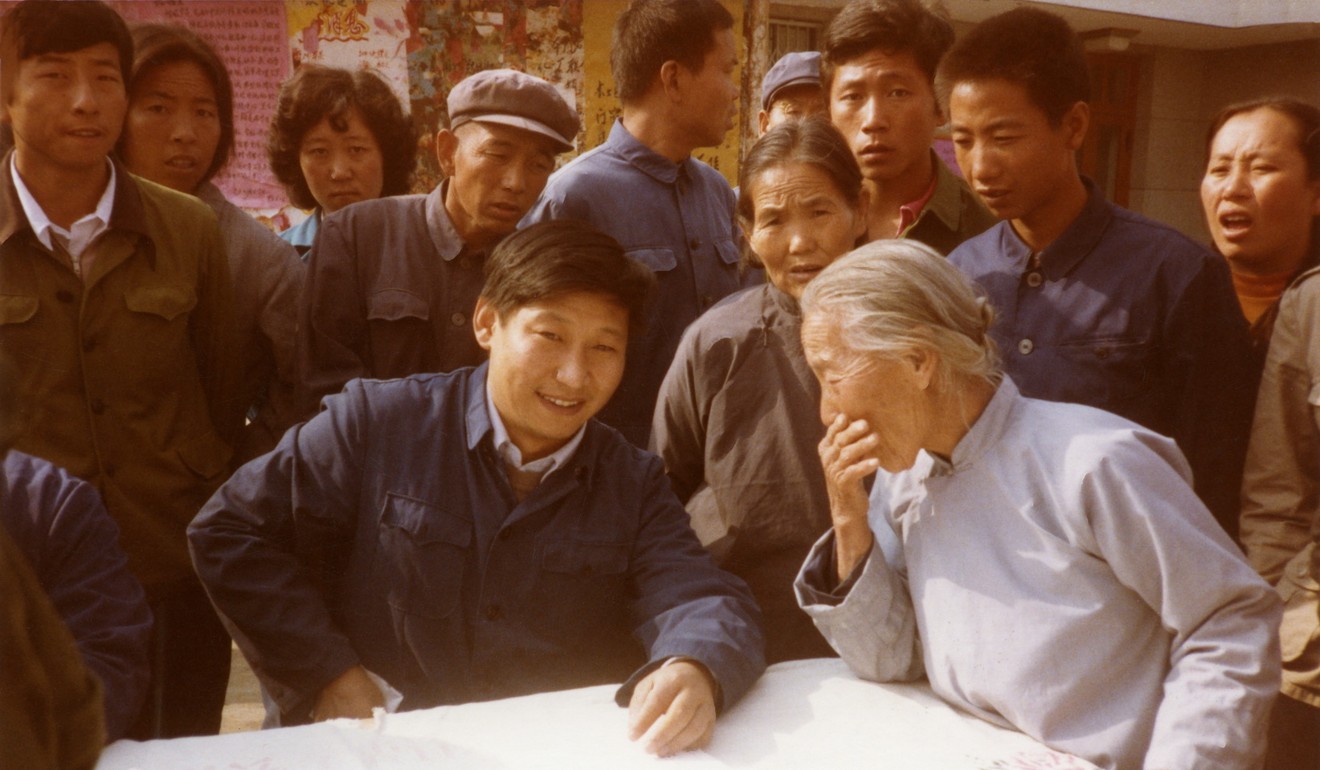 Photos of the young Xi Jinping are being released by official media to cement his authority ahead of a power shuffle this autumn. In this 1983 photo, the future Chinese president is shown as secretary of the Zhengding County Committee of the Communist Party of China, listening to villagers. Photo: Xinhua