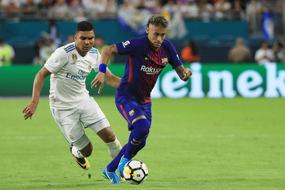 Casemiro of Real Madrid and Neymar of Barcelona vie for the ball in Miami. Photo: AFP