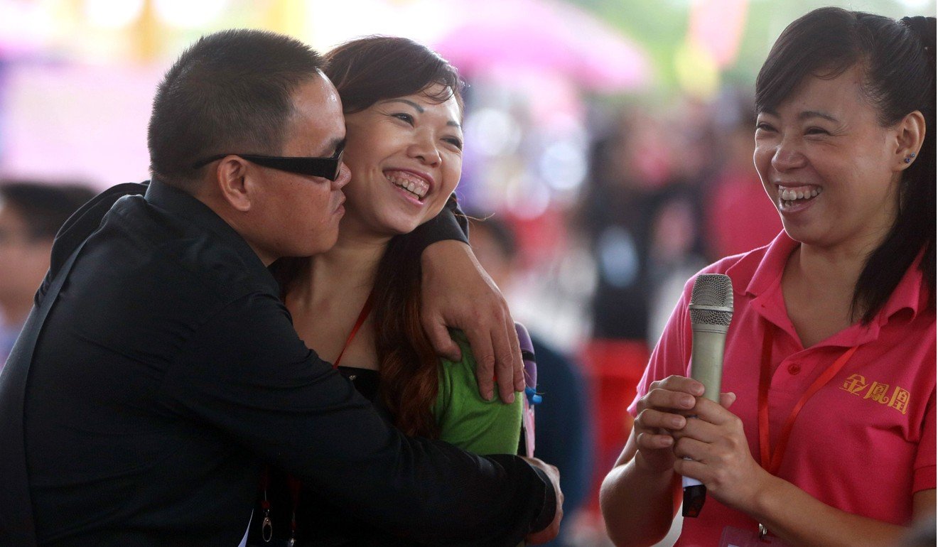 A couple meet at a matchmaking event for mostly mainland Chinese men and Hong Kong women, in Dongguan in 2013. Photo: AFP