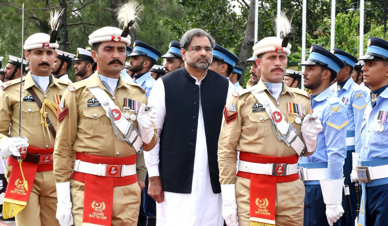 Pakistan's Prime Minister Shahid Khaqan Abbasi reviews the honour guard during a welcome ceremony at the Prime Minister House in Islamabad. Photo: AFP