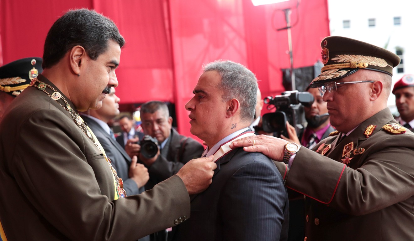 Venezuela’s President Nicolas Maduro (left) during a military parade to celebrate the 80th anniversary of the Venezuela’s National Guard. Photo: Reuters