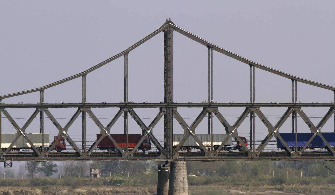 Trucks crossing a bridge connecting China and North Korea. Photo: Associated Press