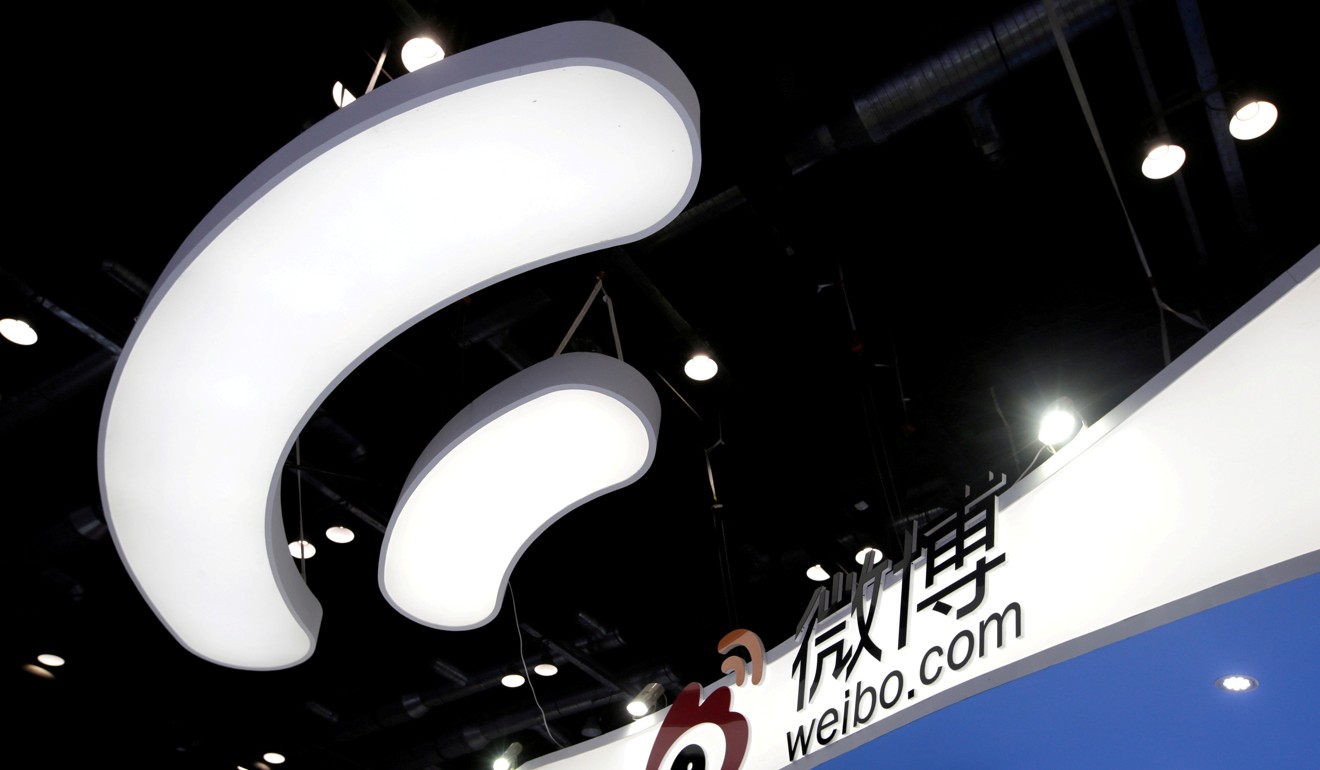 The Sina Weibo logo appears on an exhibition booth in this file photo. The Twitter-like service is being investigated by China’s cybersecurity watchdog. Photo: Reuters