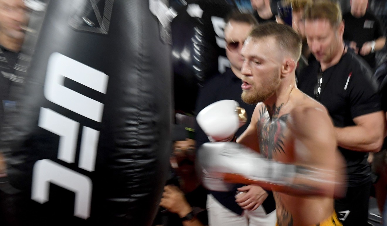Conor McGregor hits a heavy bag during his media workout. Photo: AFP