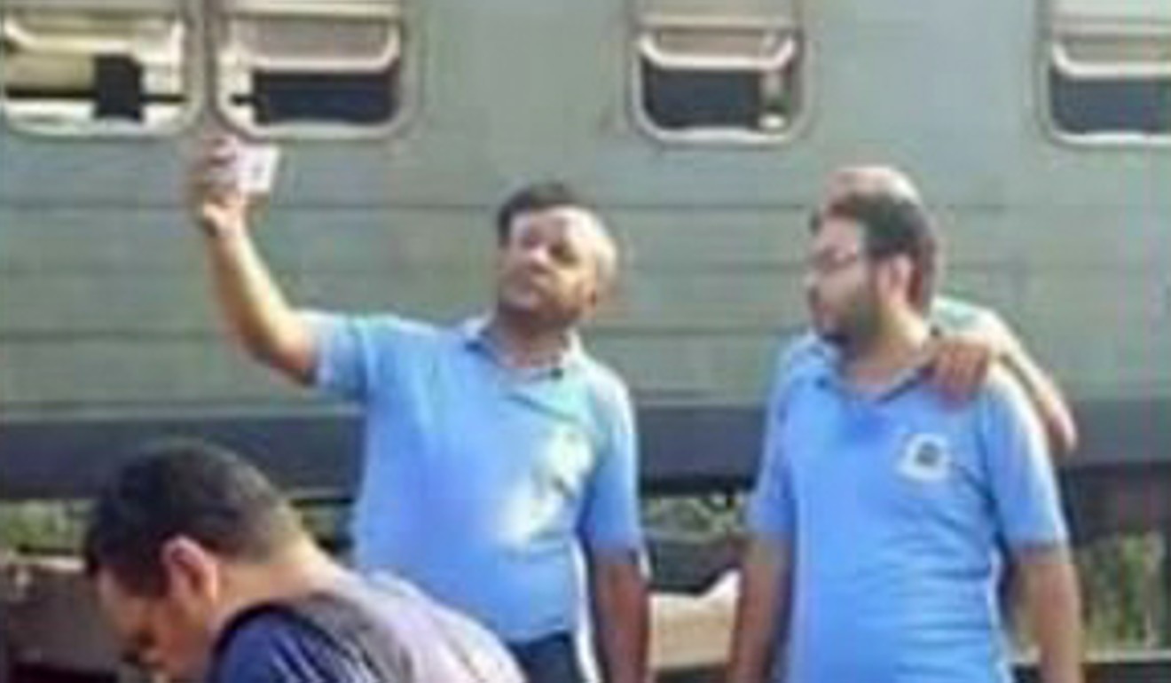 Photos of medics taking selfies in front of a deadly train wreck in Egypt have been shared on social media. Photo: Undated handout