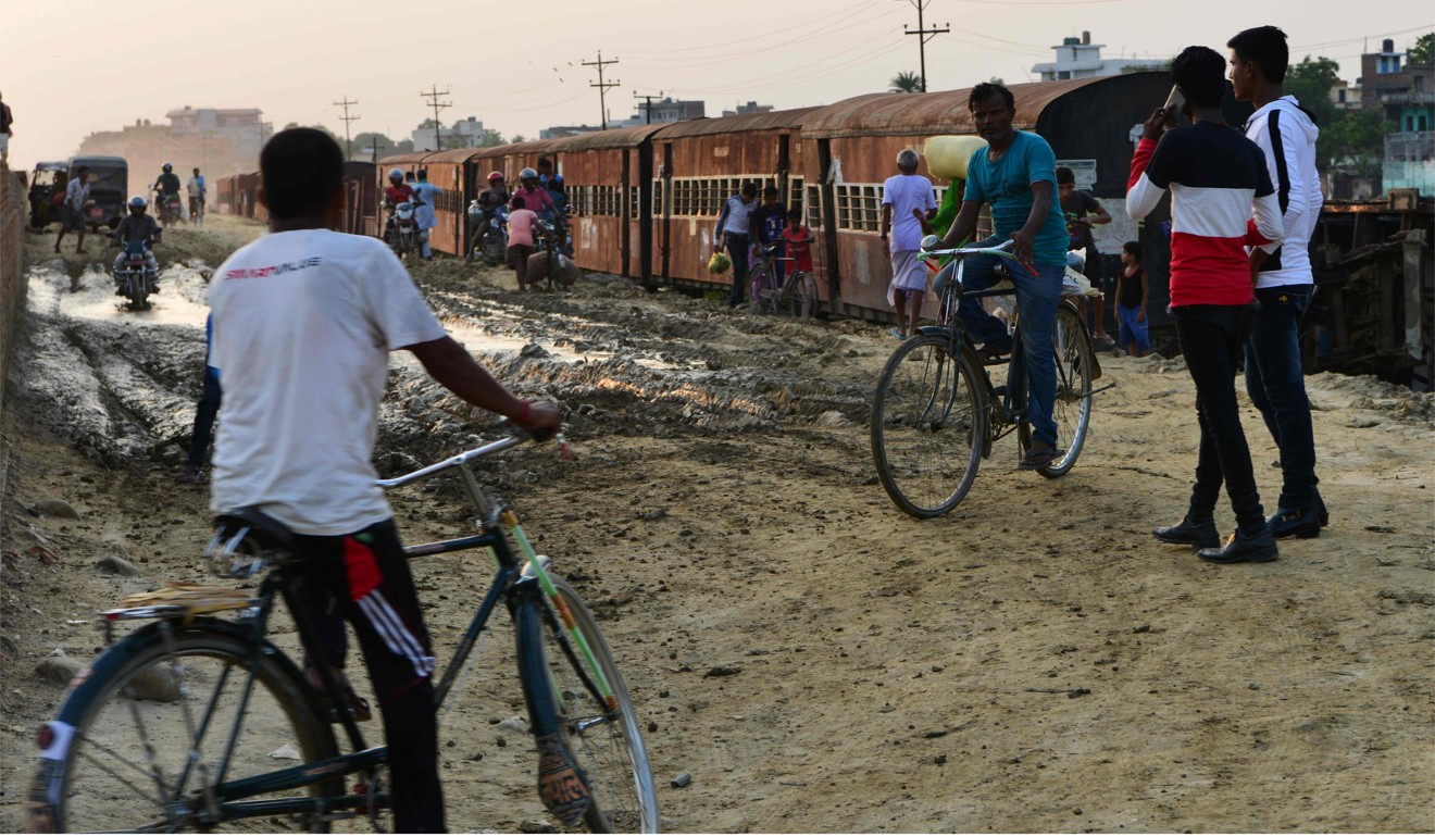 People near abandoned railway carriages of the Nepal Railway Corporation in Janakpur. Photo: AFP