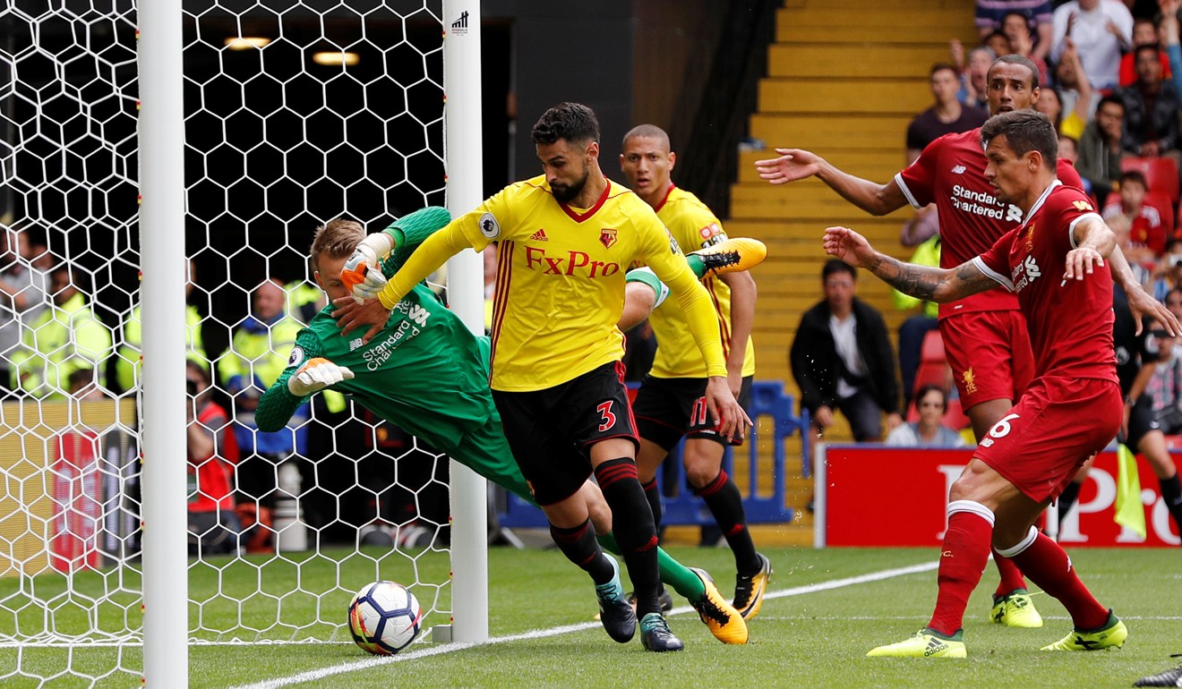 Watford's Miguel Britos scores his third against Liverpool from close range. Photo: Reuters