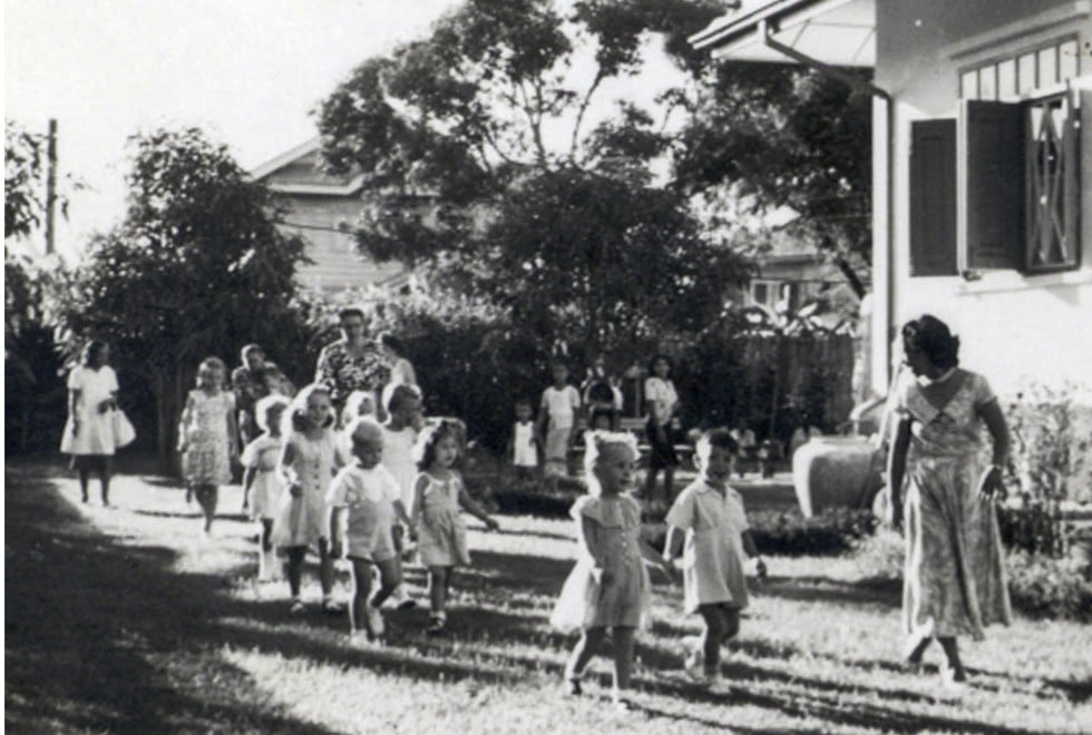 Young Ian (front) and his mother at their Bangkok home.