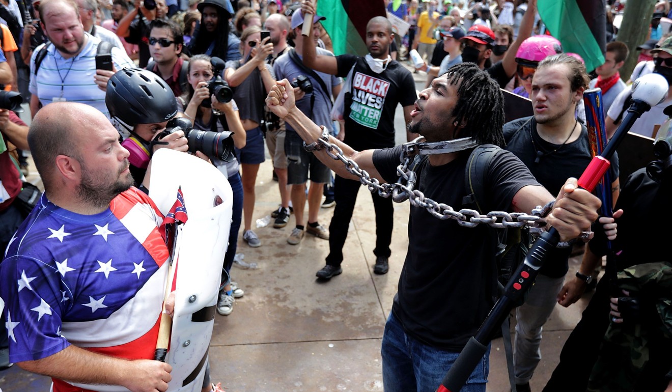 White nationalists, neo-Nazis and members of the “alt-right” exchange insults with counter-protesters in Charlottesville, Virginia. Photo: AFP