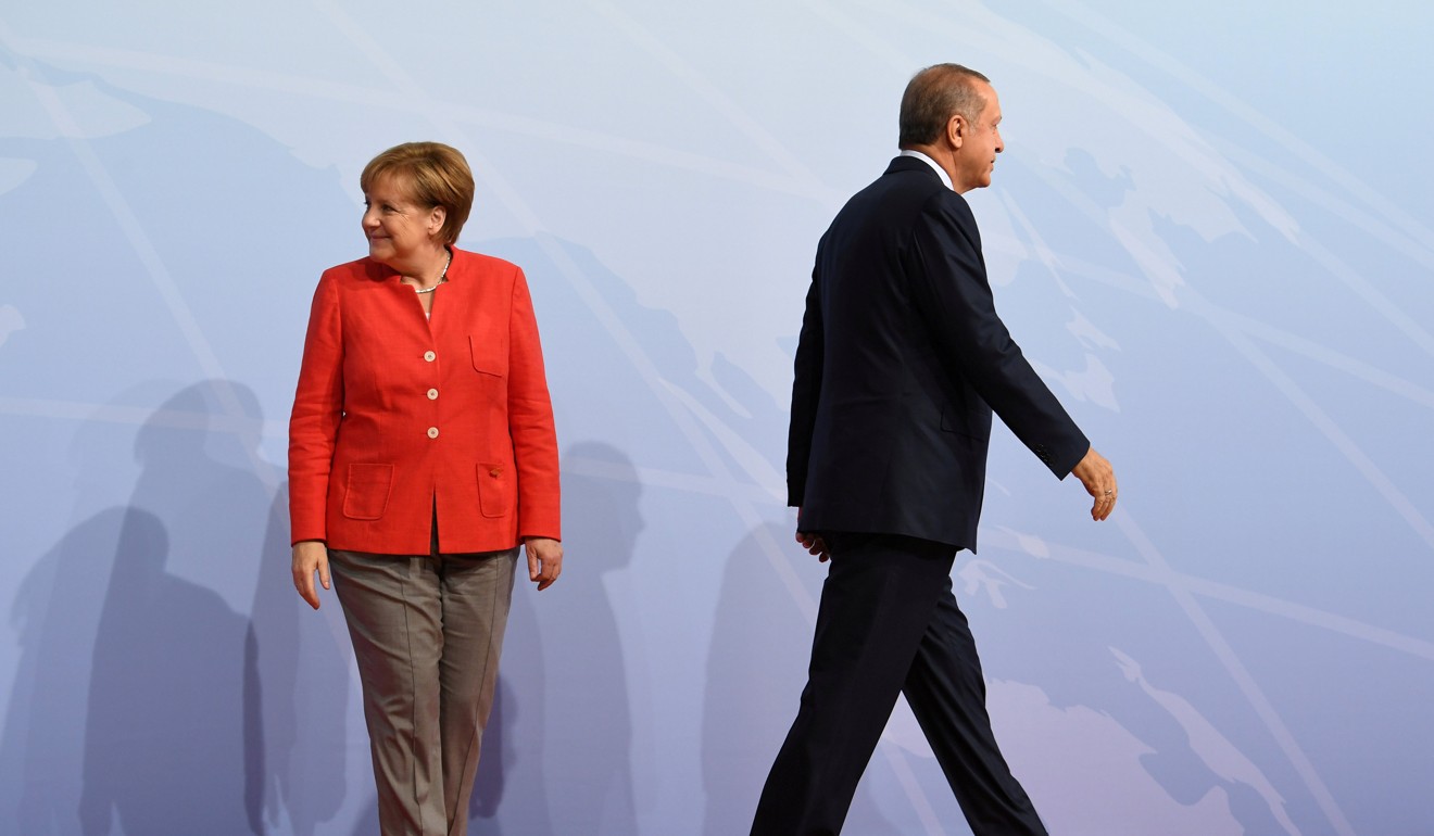 German Chancellor Angela Merkel with Turkey's President Recep Tayyip Erdogan at the beginning of the G20 summit in Hamburg on July 7. Photo: Reuters