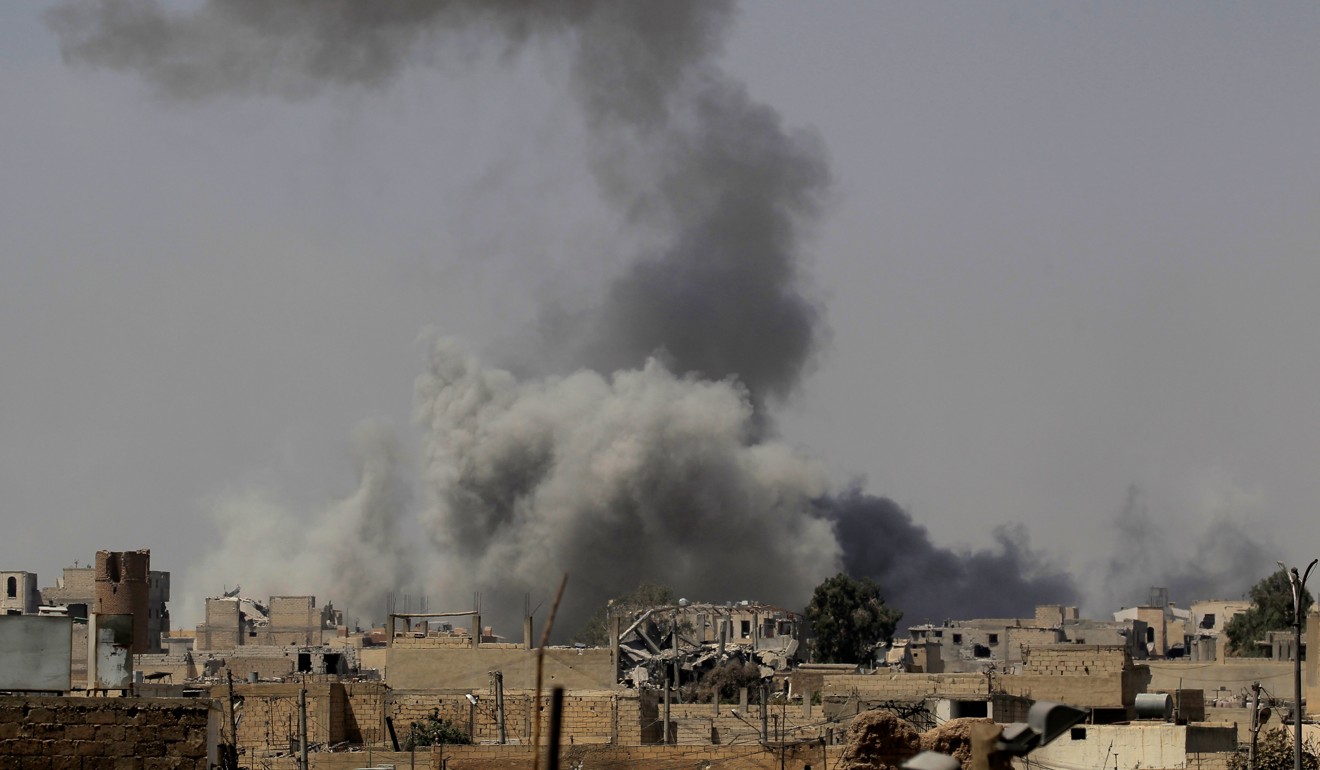 Smoke rises after an air strike during fighting between members of the Syrian Democratic Forces and Islamic State militants in Raqqa, Syria. Photo: Reuters