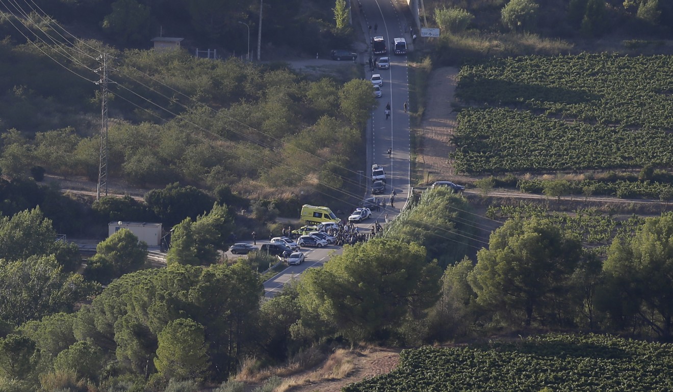 Police work at the scene on a road near Subirats, Spain, where Barcelona van suspect Younes Abouyaaqoub was shot dead. Photo: AP