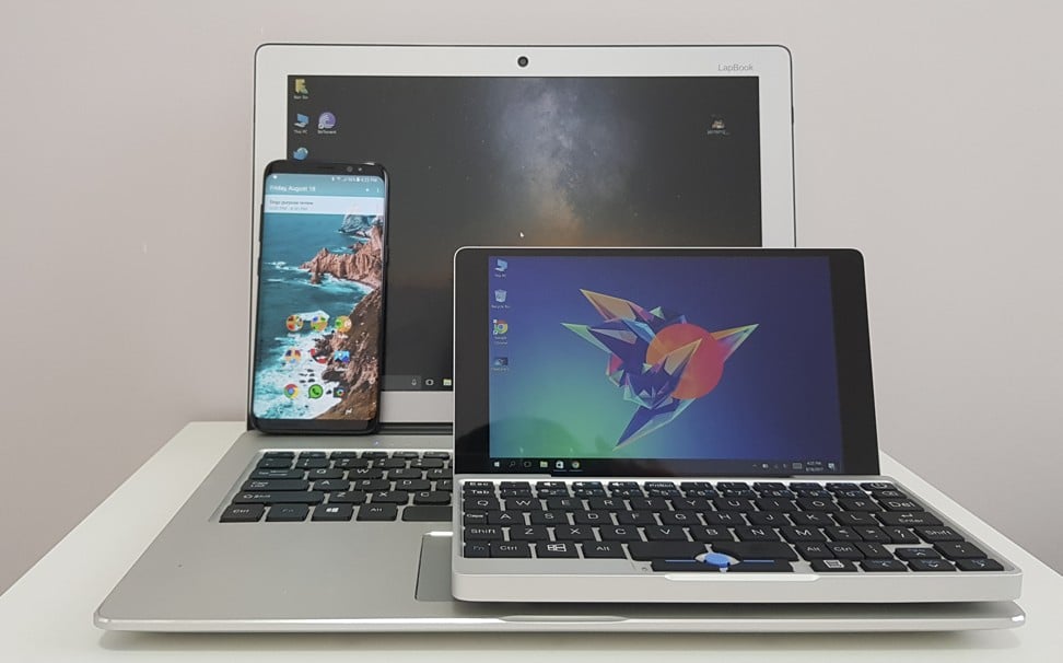 Size comparison between the GPD Pocket (right), a Chuwi 12.3 LapBook and a Samsung Galaxy S8 smartphone. Photo: Ben Sin