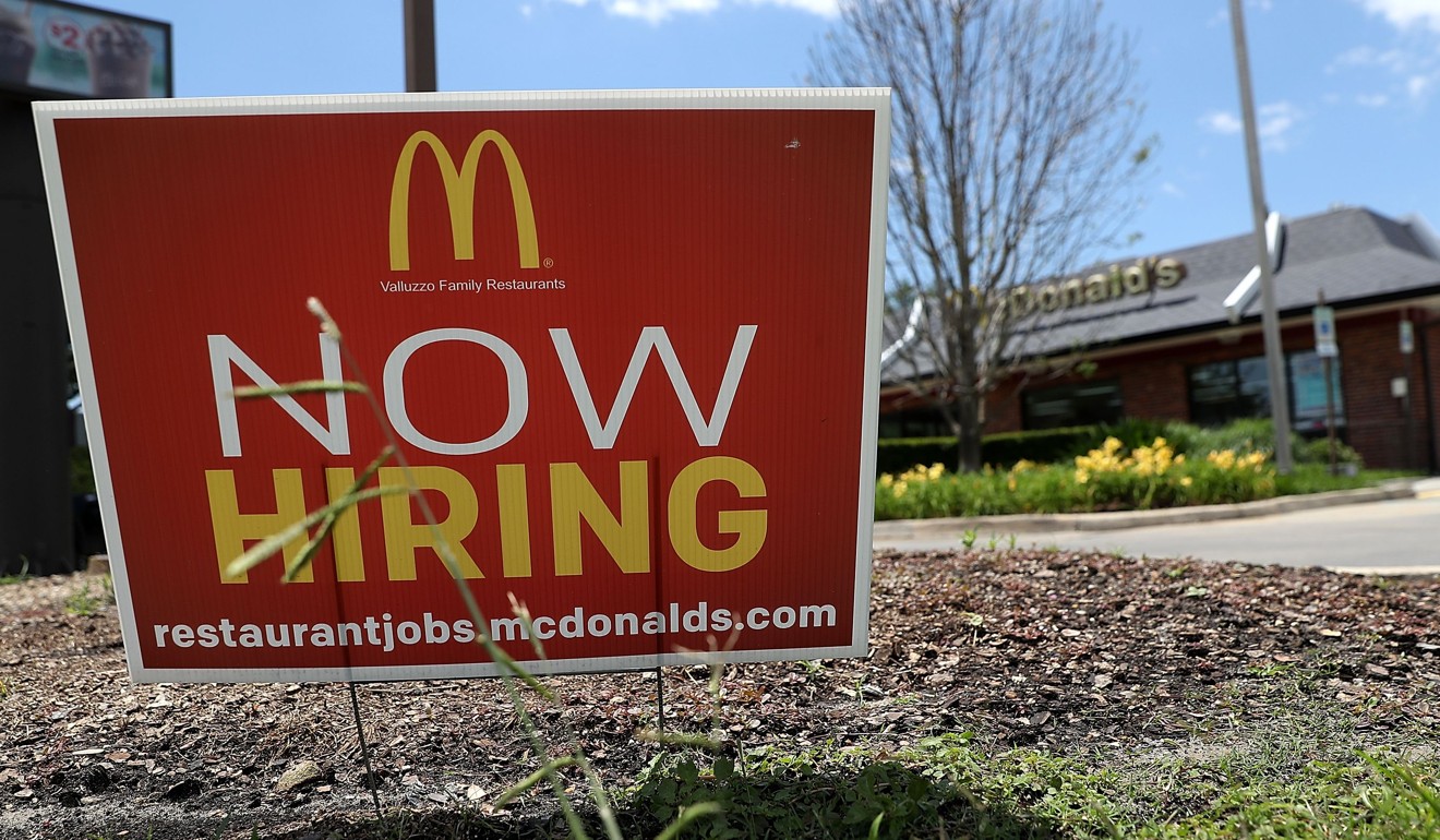 File photo shows a now hiring sign posted in front of a McDonald's restaurant in Baton Rouge, Louisiana. The US economy is chugging along with unemployment near multiyear lows. Photo: AFP